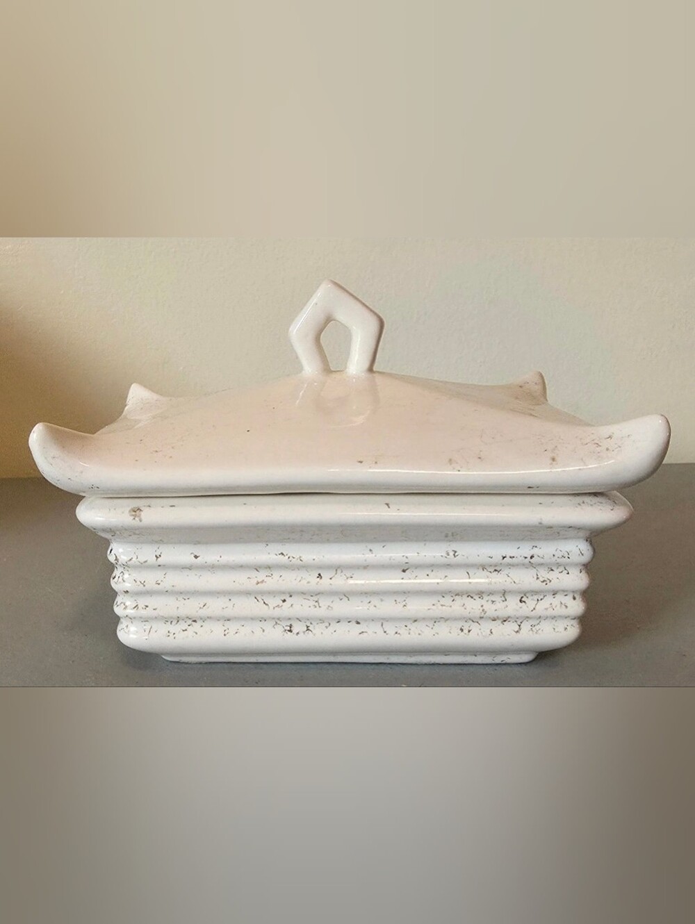 Glossy White Ceramic Base with Raised Script Mark